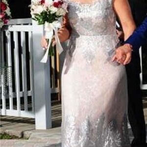 Terani Couture Ivory Lace Bridal Gown size 12 and strechy, underneath.